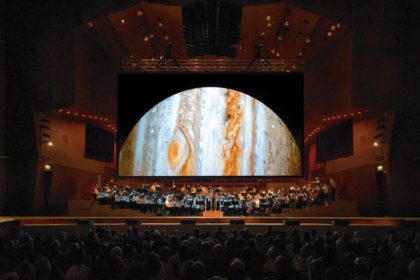 The Chicago Sinfonietta performs against the backdrop of Jose Francisco Salgado's images