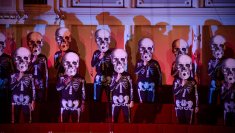 A masked choir performs Mozart's Requiem with the Chicago Sinfonietta at their 2013 Dia de los Muertos concert