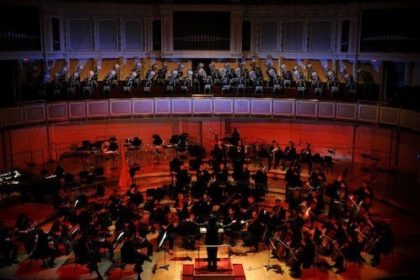 A masked chorus sings Mozart's Requiem alongside the Chicago Sinfonietta