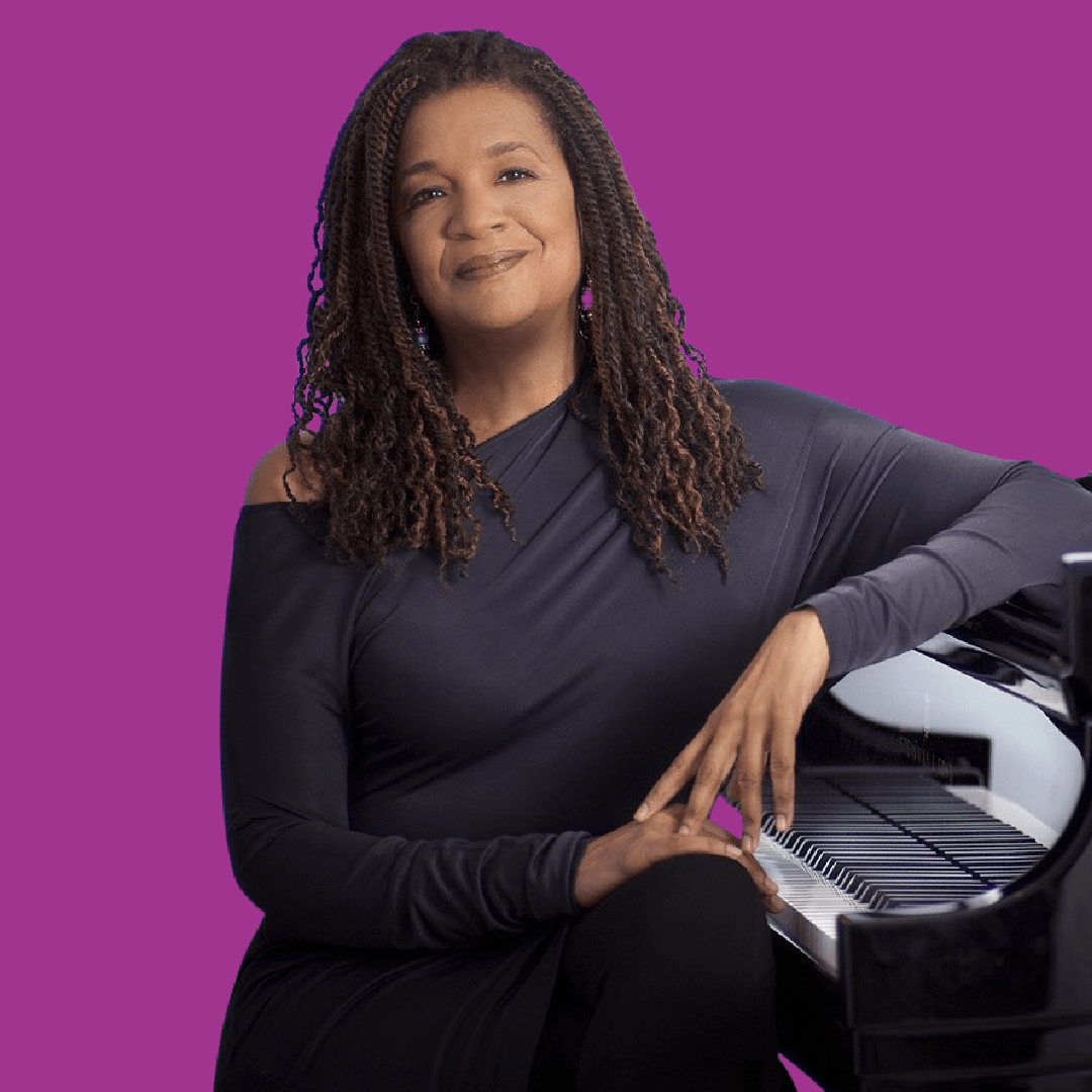 Composer seated at piano with purple background