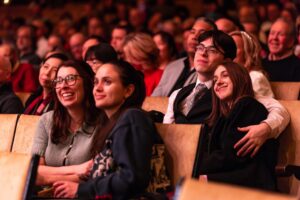 Audience members watching Chicago Sinfonietta and subscribing.