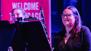 A woman holding a clarinet