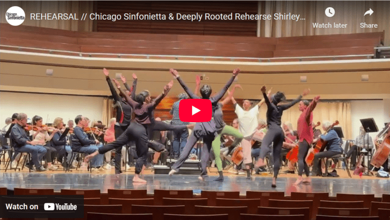 A video screenshot with dancers in a circle.